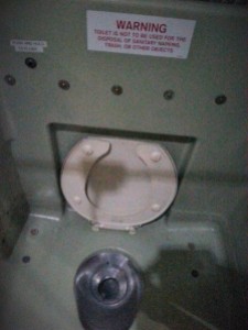 The sole sit-down toilet on-board the C-130.